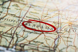 Alabama circled with red marker on map. Close up shot.
