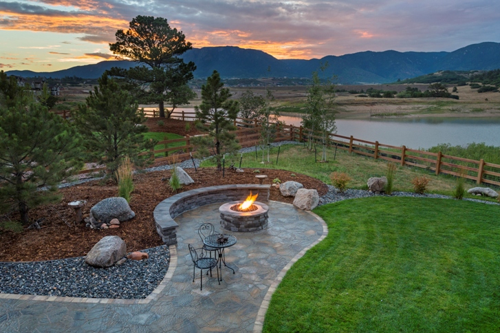 outdoor fireplace of a lakefront home